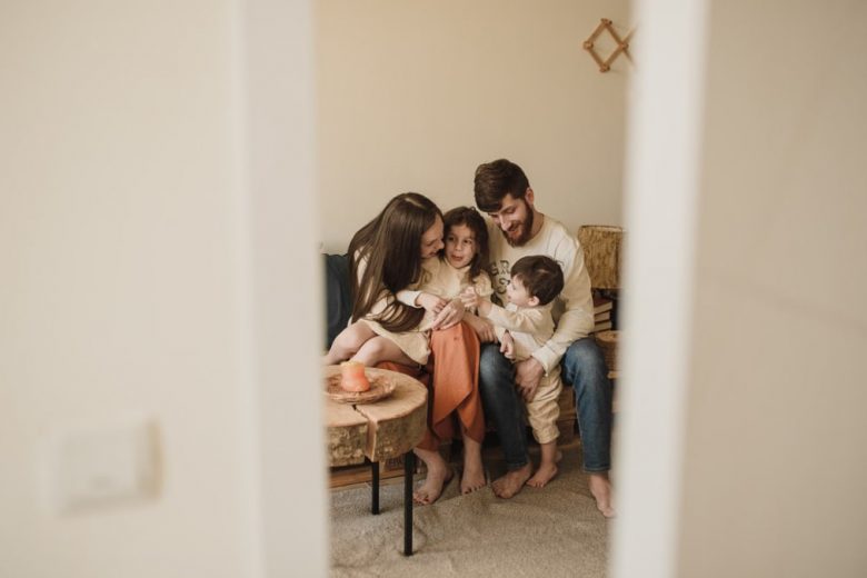 A loving family enjoying a warm, intimate moment together indoors.